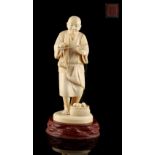 Property of a gentleman - a Japanese carved ivory okimono depicting an egg seller, Meiji period (