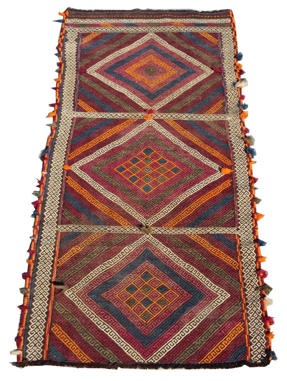 A Kelim runner with multi coloured ground, 82 by 28ins. (208 by 70cms.) (see illustration).