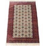 Property of a lady - a Turkoman rug with ivory field, third quarter 20th century, condition very