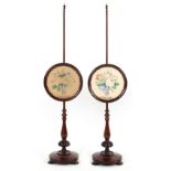 Property of a lady - a pair of early Victorian rosewood polescreens, the circular panels each with a