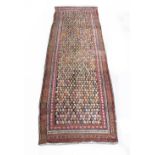 Property of a lady - an early 20th century Hamadan runner, worn, 132 by 39ins. (336 by 39ins. ) (see