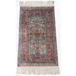 Property of a lady - a fine quality silk prayer rug, 49 by 29ins. (125 by 74cms.) (see
