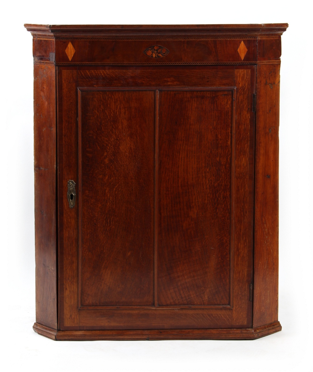 Property of a lady - a George III oak & inlaid corner wall cabinet, 37.4ins. (95cms.) high (see