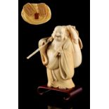 Property of a gentleman - a Japanese carved ivory okimono depicting Hotei, Meiji period (1868-1912),