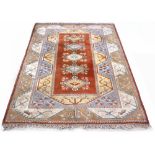 Property of a lady - a Turkish Kazak style rug with pale ground, 117 by 79ins. (297 by 211cms.) (see