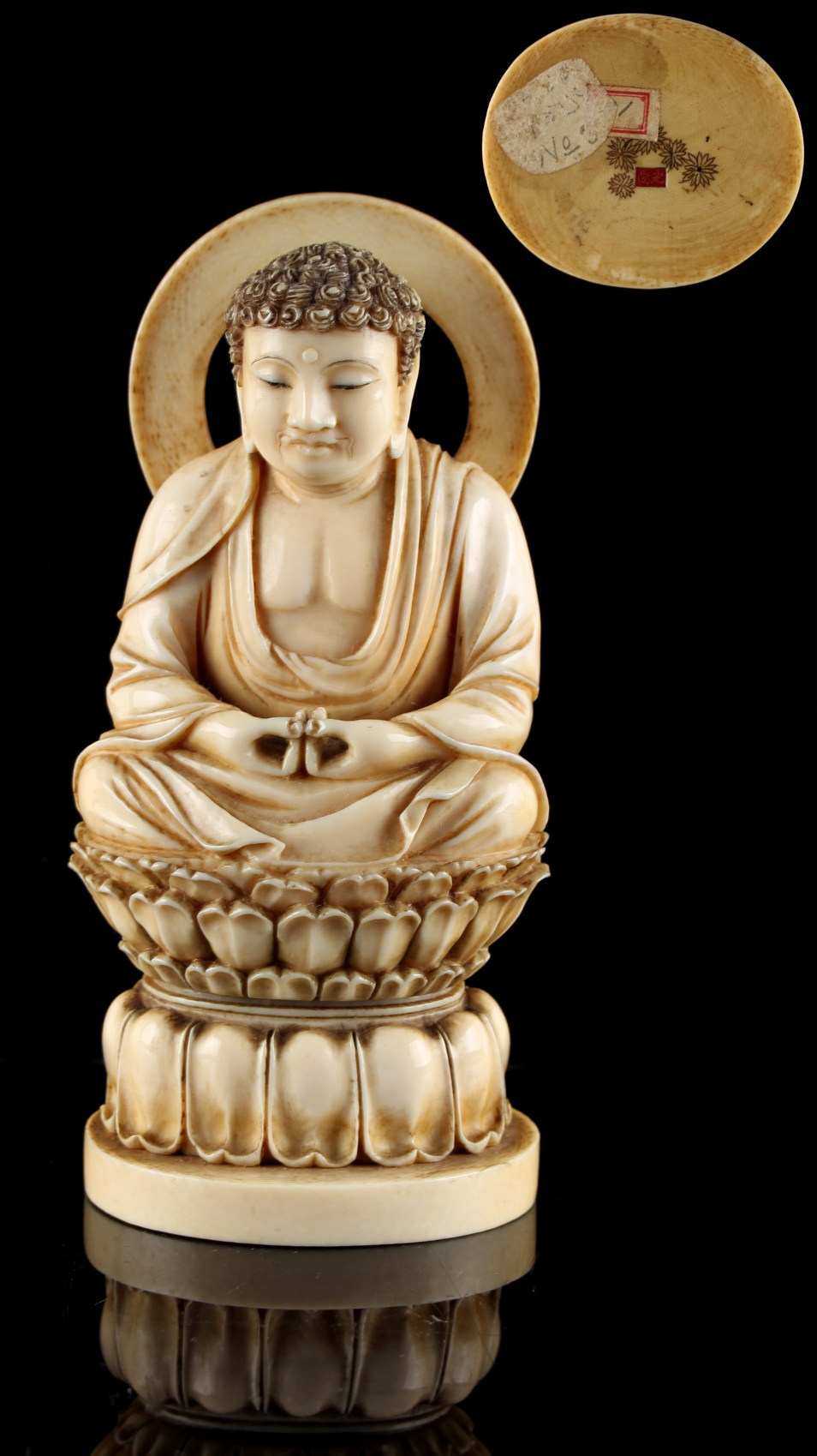 A good 19th century Japanese carved ivory okimono depicting Amida Buddha seated in dhyanasana with