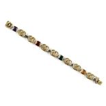 A 14ct yellow & white gold multi gem set link bracelet, with four variously coloured square cut