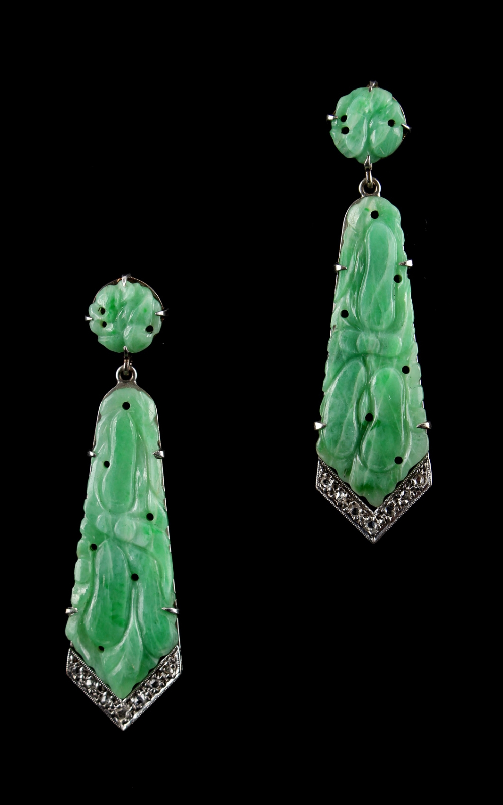 A pair of Art Deco style unmarked white gold or platinum & carved jadeite pendant earrings, with