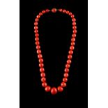 A good coral graduated bead necklace, the forty-four faceted beads ranging from approximately 7.3 to