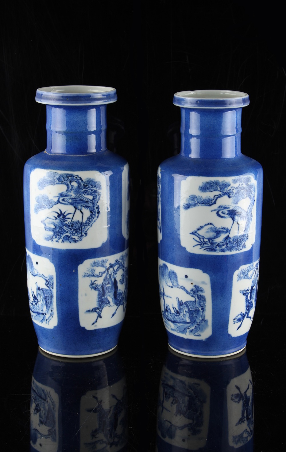 A pair of powder blue rouleau vases, 19th century, painted with panels of Immortals, animals &