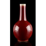 A Chinese flambe glazed bottle vase, 18th / 19th century, 9.5ins. (24.1cms.) high (see