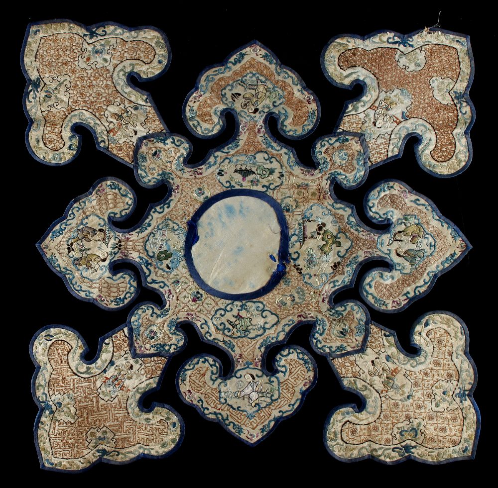 A 19th century Chinese embroidered silk cloud collar, 26ins. (66cms.) across (see illustration).