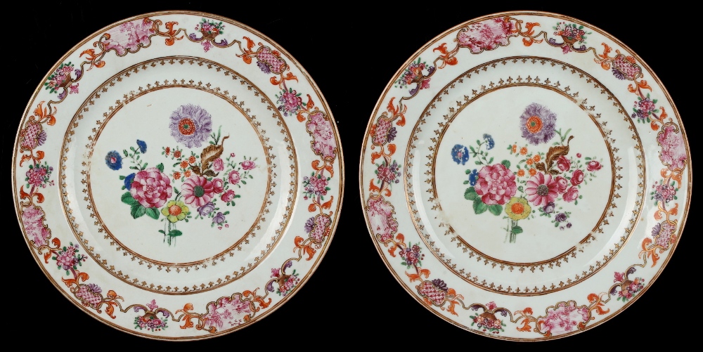 A pair of Chinese famille rose plates, Qianlong period (1736-1795), each painted with flowers to the