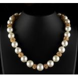 A fine yellow gold pearl & diamond necklace by Wempe, the twenty-four large pearls ranging from 11.