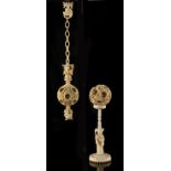 Two Chinese carved ivory puzzle balls, late 19th / early 20th century, one suspended from a chain,