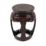 A Chinese carved two-colour tixi style lacquer drum stand or stool, 18.5ins. (47cms.) high (see