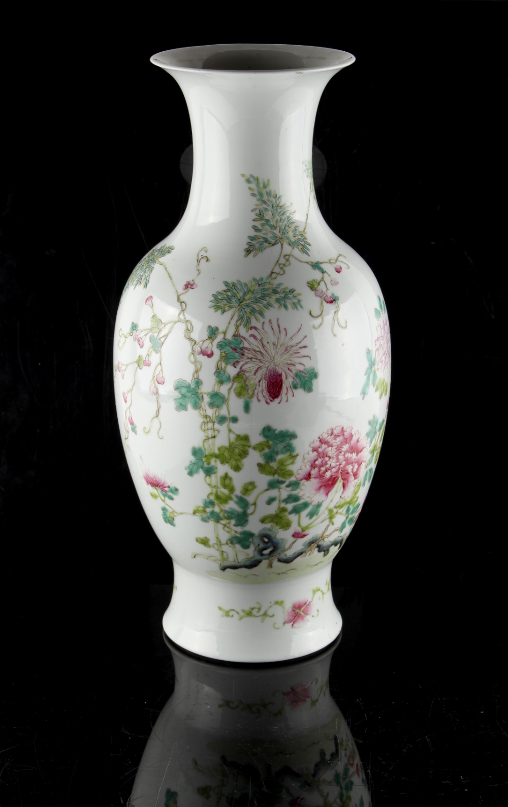 A Chinese famille rose baluster vase, painted with peonies among rockwork, iron red Qianlong 4-