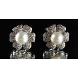 A pair of 18ct white gold pearl & diamond flowerhead earrings, the pearls approximately 8.3mm