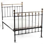 Property of a deceased estate - a late 19th / early 20th century brass & iron 4' double bedstead (