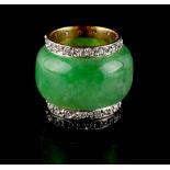 An 18ct yellow gold apple green jadeite & diamond scarf ring, 0.65ins. (1.7cms.) diameter (see