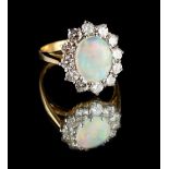 An 18ct yellow gold opal & diamond cluster ring, the centre oval opal weighing approximately 1.05