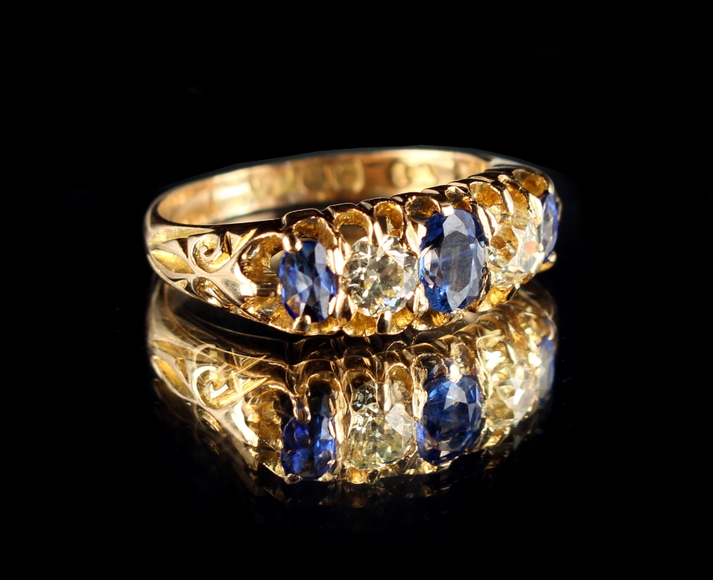 An Edwardian 18ct yellow gold sapphire & diamond five stone ring, the three oval cut sapphires