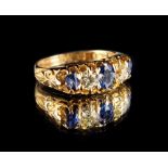 An Edwardian 18ct yellow gold sapphire & diamond five stone ring, the three oval cut sapphires