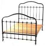 Property of a deceased estate - an early 20th century brass & iron 4' double bedstead (see