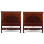 Property of a lady - a pair of Edwardian mahogany single bed headboards (2) (see illustration).