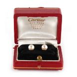 A pair of Cartier 14ct yellow gold & certificated natural saltwater pearl studs, the pearls each