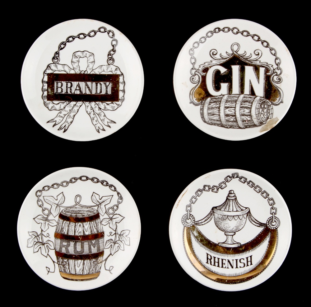 Property of a deceased estate - a set of four Fornasetti 'Vini e Liquori' coasters, one with rim