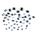 Loose gemstones - a bag containing rectangular cut sapphires, approximately 23.02 carats total (