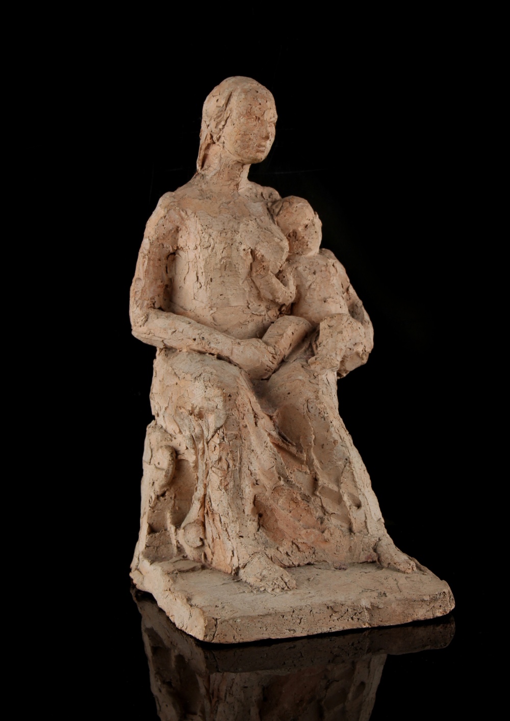 Property of a deceased estate - a pottery figure of a seated mother & child, unsigned, 8.65ins. (