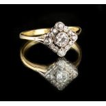 An 18ct yellow gold diamond cluster ring, the centre collet set brilliant cut diamond in a diamond