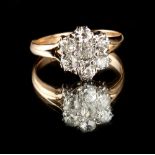 An unmarked yellow gold diamond flowerhead cluster ring, the seven round Old European cut diamonds