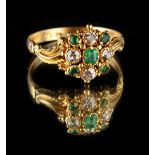 A Georgian 18ct yellow gold emerald & diamond cluster ring, with stylised leaf shoulders, size Q (