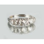 An 18ct white gold diamond five stone ring, the graduated Old European cut diamonds in pierced