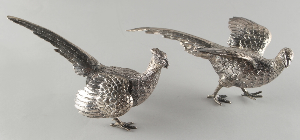 Property of a lady - a pair of silver models of pheasants, import marks for London 1959, tip of