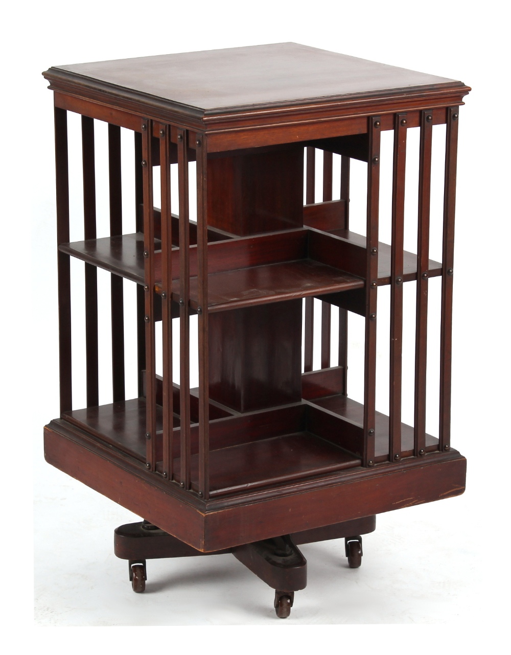 Property of a gentleman - an Edwardian mahogany revolving bookcase, 19.25ins. (49cms.) square (see