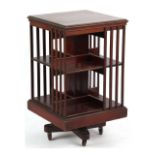 Property of a gentleman - an Edwardian mahogany revolving bookcase, 19.25ins. (49cms.) square (see