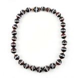 A banded agate graduated bead necklace, the twenty-eight individually knotted beads ranging from