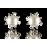 A pair of platinum pearl & diamond flowerhead cluster earrings, each with a large central pearl