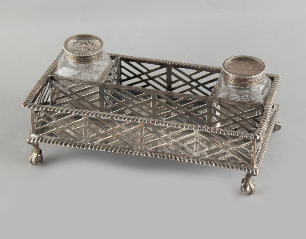 Property of a lady - an early George III silver inkstand, of pierced rectangular form with gadrooned