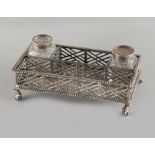 Property of a lady - an early George III silver inkstand, of pierced rectangular form with gadrooned