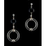 A pair of rock crystal black enamel & diamond pendant drop earrings, each with a rock crystal ring
