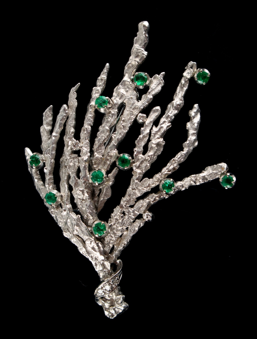 Property of a lady - a 14ct white gold brooch modelled as a coral branch, set with ten round cut