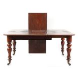 Property of a lady - a Victorian mahogany extending dining table with two extra leaves, on turned