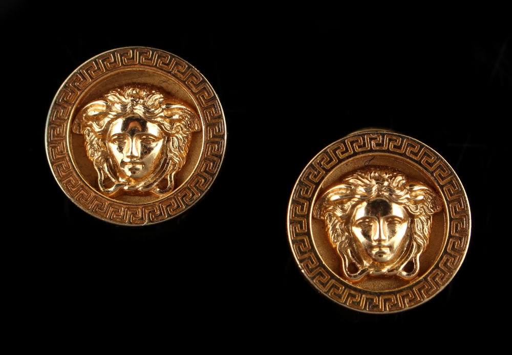 Gianni Versace - a pair of 18ct yellow gold earrings by Versace, each with a circular panel