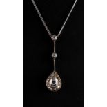 A diamond pendant necklace, the pear shaped diamond within a border of fourteen diamonds in pear