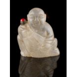 Property of a gentleman - a Chinese carved rock crystal snuff bottle modelled as a seated figure